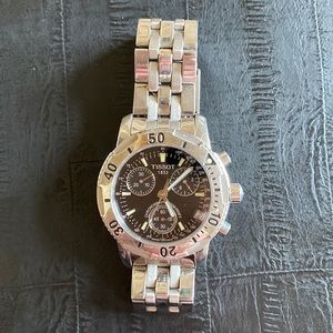 Men’s stainless steel Tissot watch.
